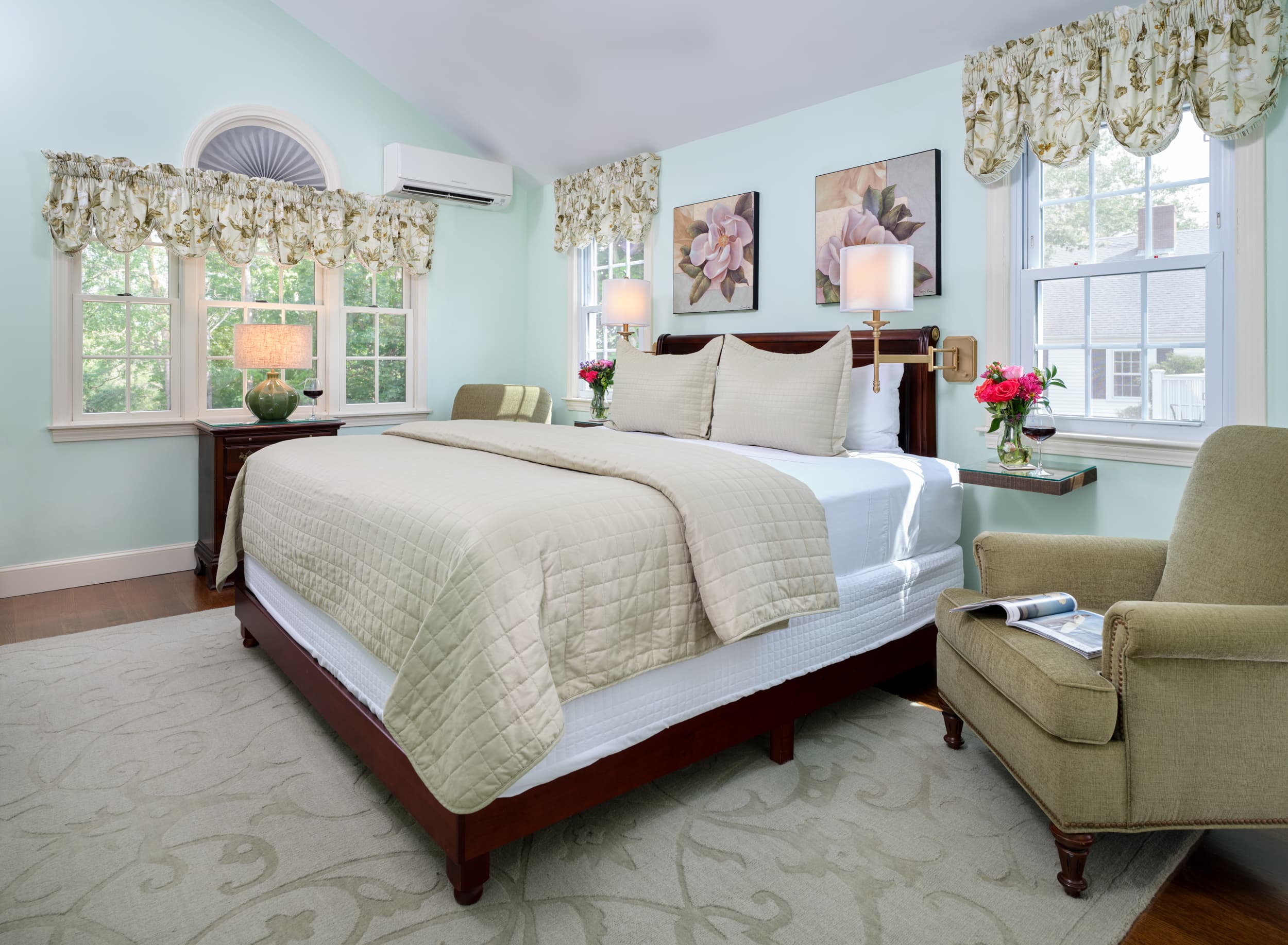 King Bed with bed spread in green flower pattern, TV/DVD,ceiling fan and Cathedral ceilings, two reding chairs