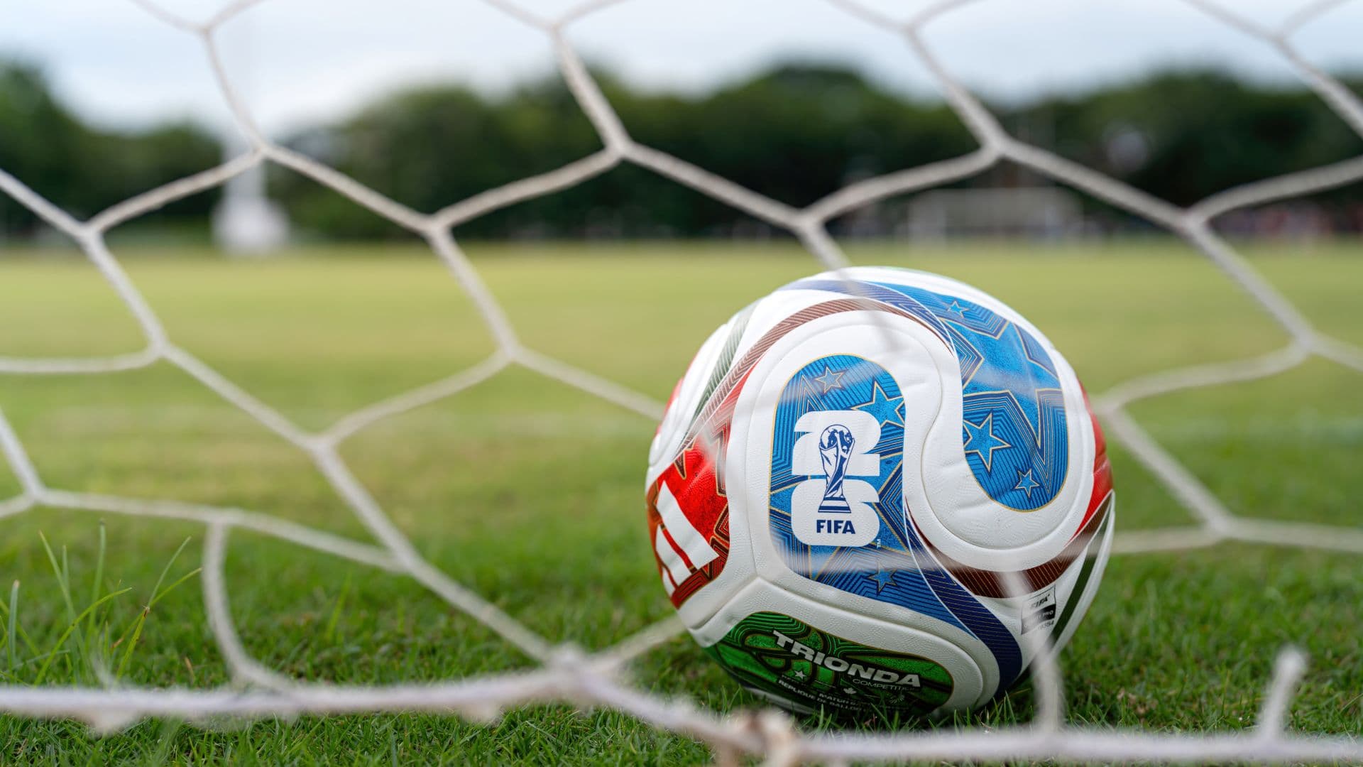 A soccer ball caught in a net A soccer ball caught in a net
